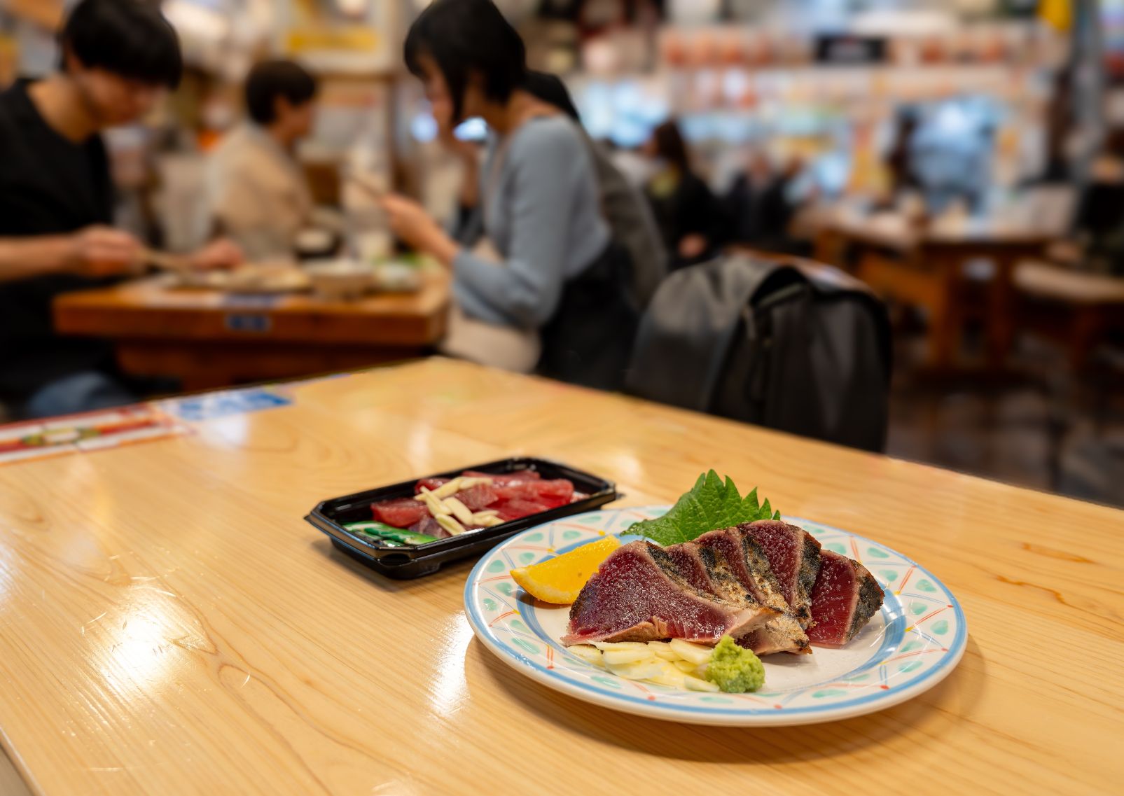 Table with local food at market in Kochi, Japan