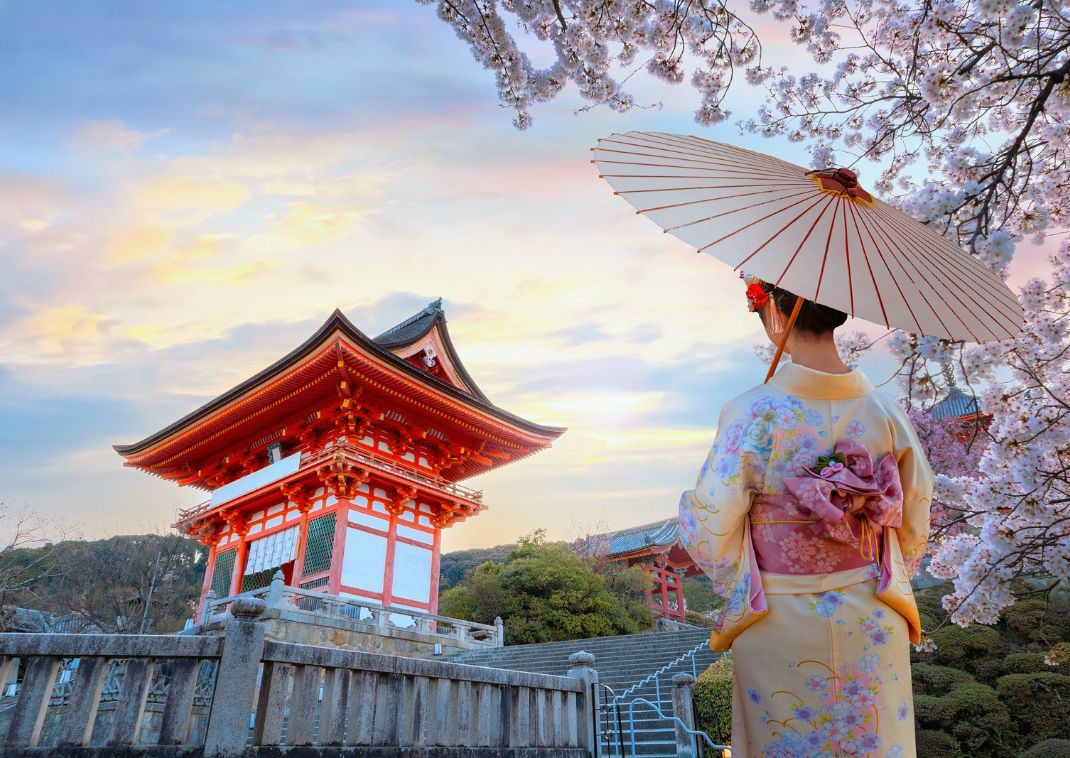 Scenic view of Young Japanese woman in a traditional Kimono dress at Kiyomizu-dera temple