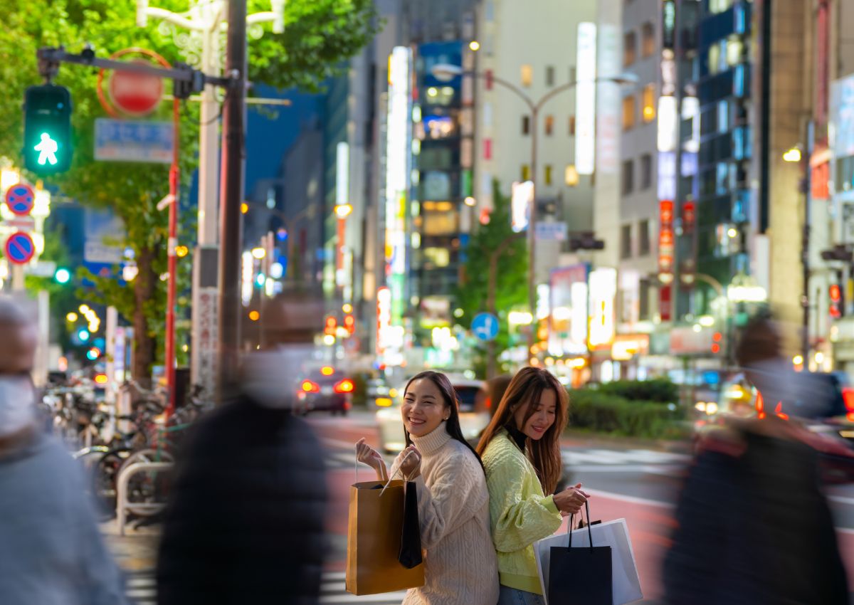 Girls shopping at night in Tokyo, Japan