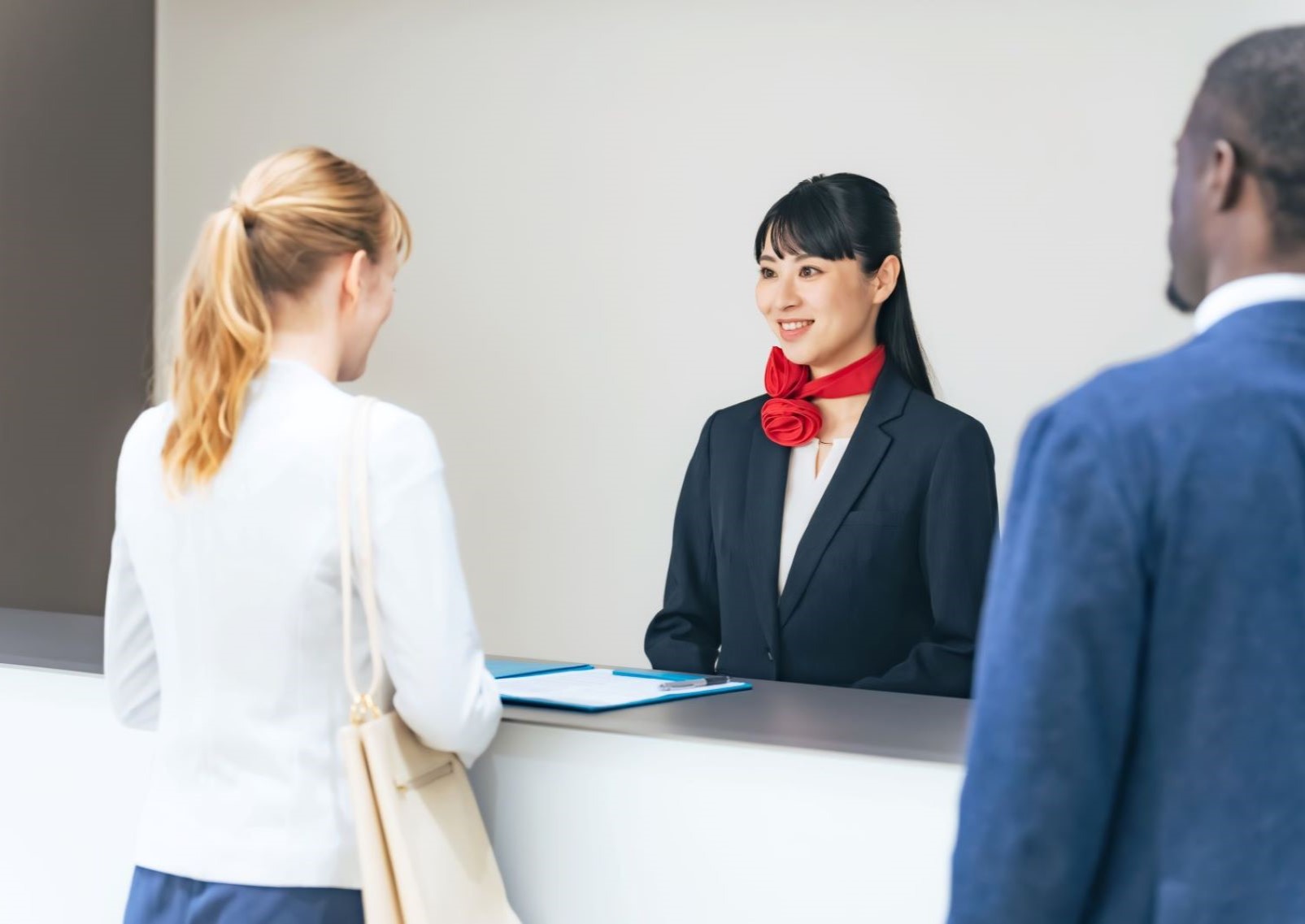 People checking in at Japanese hotel