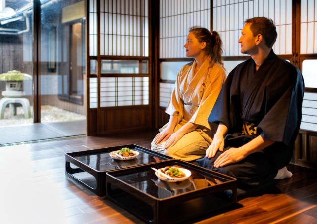 Couple enjoying dinner in a traditional Ryokan in Japan