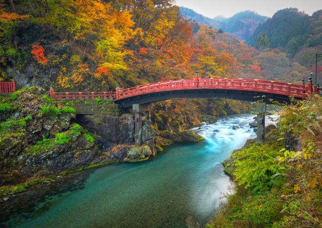 Autumn scene in Nikko with the red Shinkyo Bridge