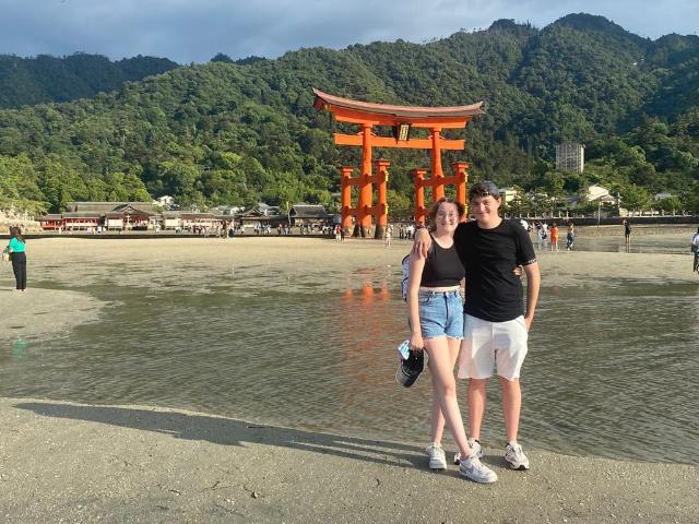 The children by the torii gate of the Itsukushima Shrine on Miyajima