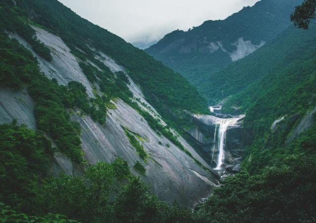 Senpiro waterfall flowing into the mountains in Yakushima, Japan