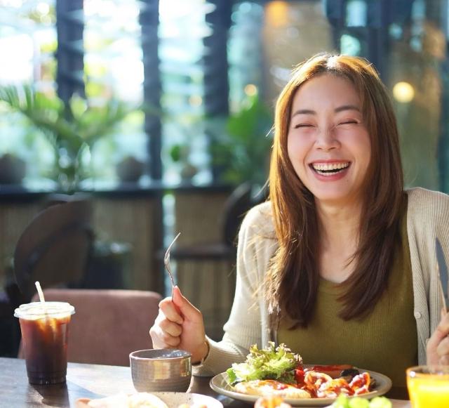 Woman enjoying gluten-free meal, Japan