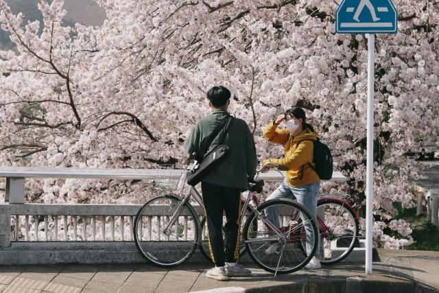 Couple biking in Kyoto