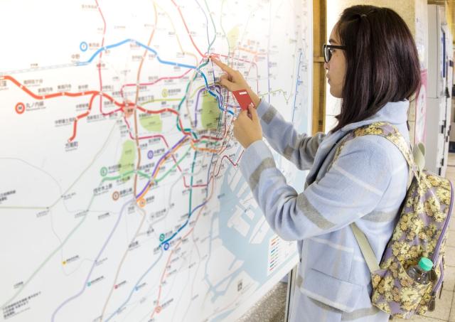 Traveller navigating train system in Tokyo, Japan