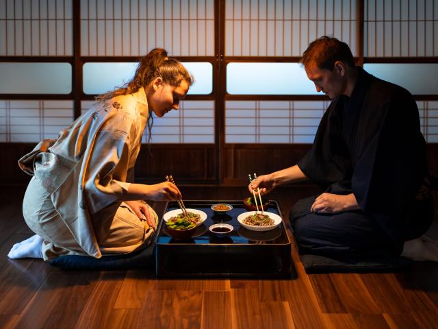 A couple eating Japanese food in a traditional room