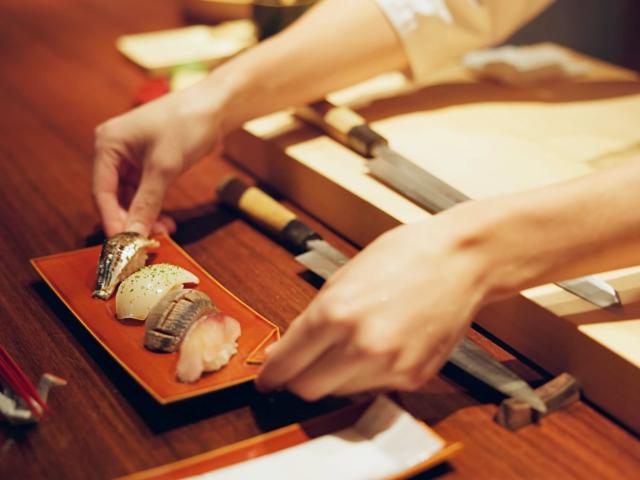 Serving sushi in a restaurant