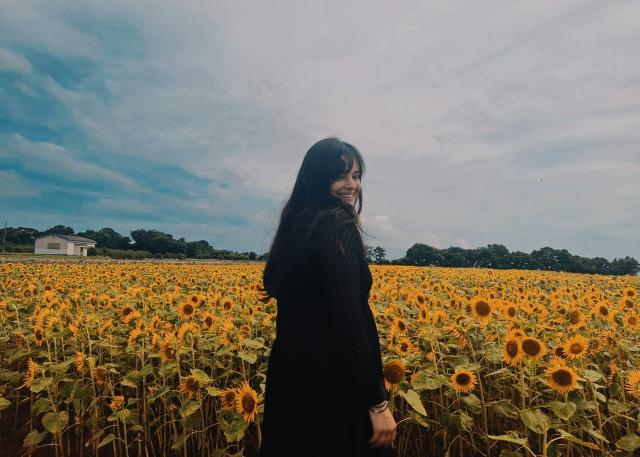 Surrounded by a sea of sunflowers in the Kyushu countryside