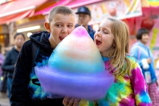 Kids enjoying cotton candy in Harajuku, Tokyo