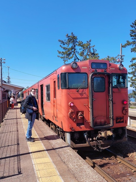 Travelling on one of the retro style regional trains on the coast of Toyama Prefecture