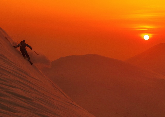 Skiing in Niseko at sunset