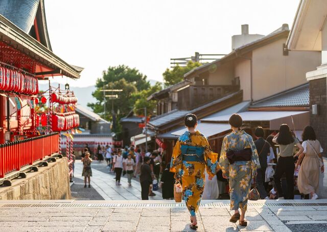 Young women wearing Japanese traditional kimono at Fushimi Inari Shrine 