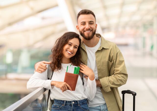 Couple showing passports at airport