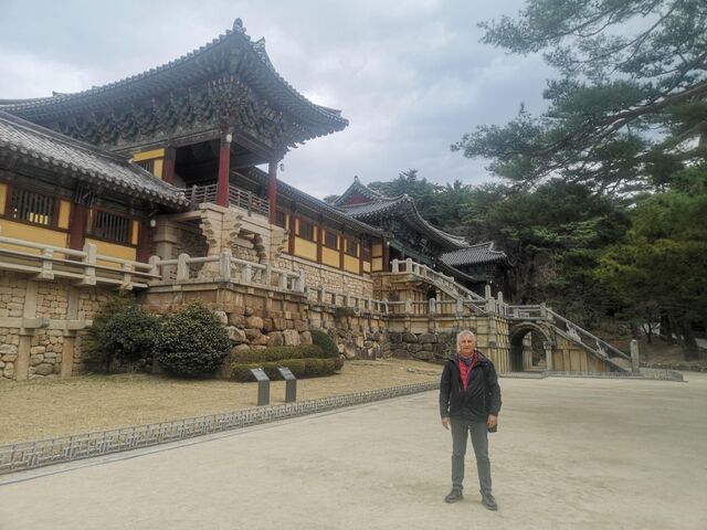 In front of a traditional Korean architectural complex 
