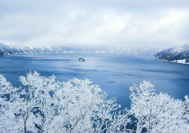 Lake Mashu covered in rime ice