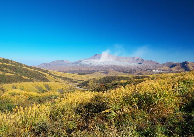 Smoke rising from Mount Aso in autumn