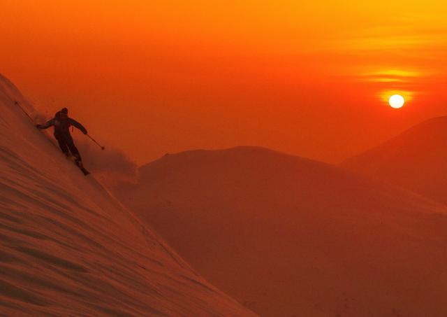 Skiing in Niseko at sunset