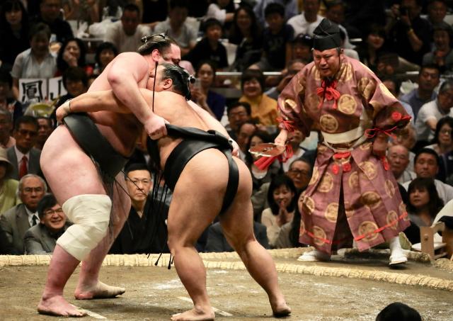 Sumo wrestlers fighting, Tokyo