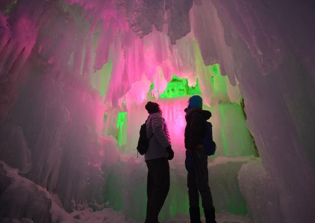 In the hall room Illuminated ice cave with tourist at Snow Festival Sapporo, Hokkaido, japan
