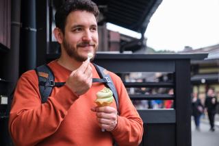 Tourist enjoying food in Takayama