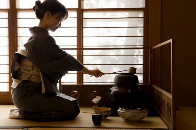 Woman performing a tea ceremony