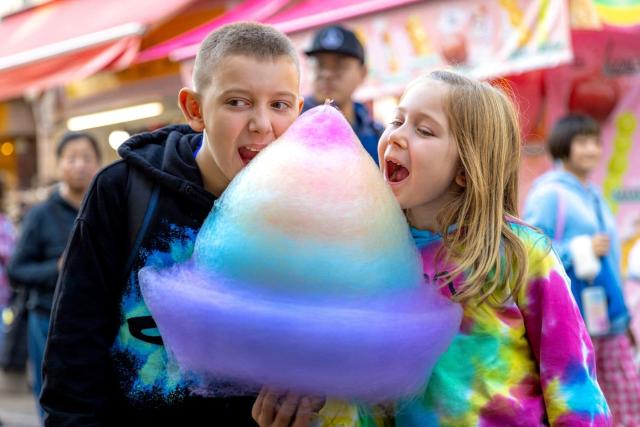 Kids enjoying cotton candy in Harajuku, Tokyo
