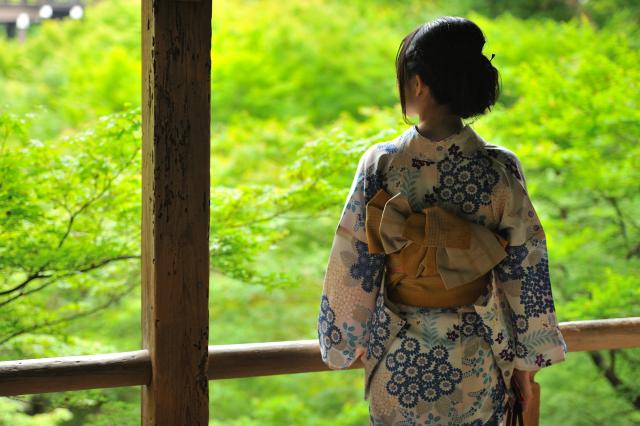 Lady in kimono in Japanese garden