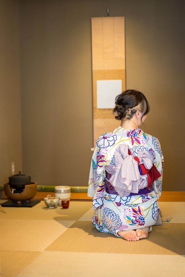 Girl in yukata in a traditional tea room